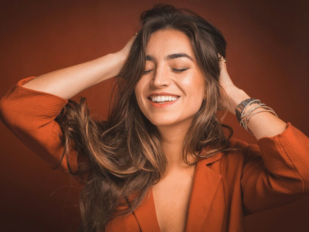 Smiling woman with long glossy hair